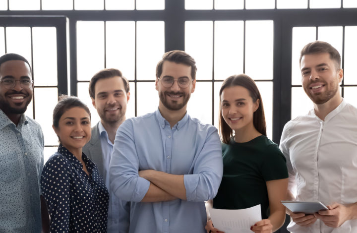 Group portrait of successful multiethnic business team in office